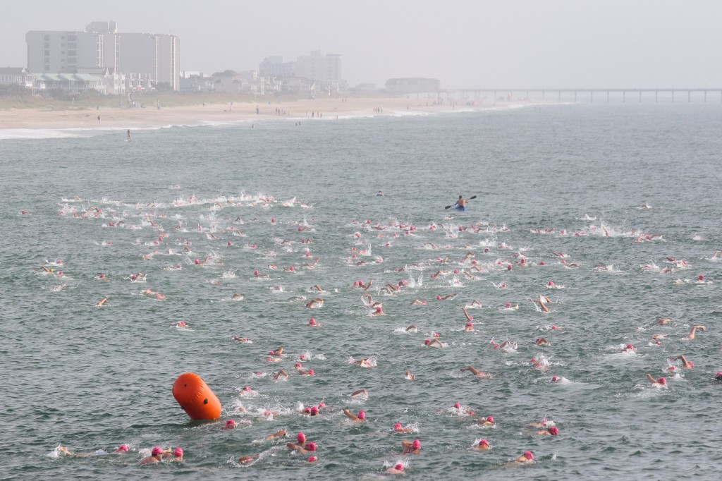 Hundreds of contestants in the Wilmington Family YMCA Pier-2-Pier race swim north toward Johnnie Mercer's Pier from Crystal Pier. 