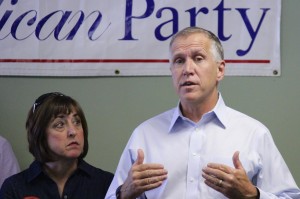 Staff photo by Cole Dittmer. Republican candidate for U.S. Senate Thom Tillis addresses a crowd of supporters at New Hanover County GOP Headquarters on Oct. 30, with wife Susan Tillis by his side. 