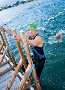 Staff photo by Emmy Errante. Brad Southerland climbs out of the water at Seapath Yacht Club during the Wilmington YMCA Triathlon Saturday, Sept. 27 in Wrightsville Beach.