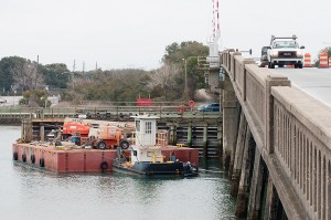Equipment is staged in the Intracoastal Waterway north of the Heide Trask drawbridge in preparation for night work March 4.