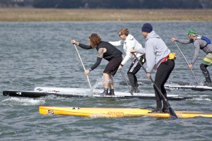 Competitors begin the paddleboard leg of the Wrightsville Beach Biathlon March 28.