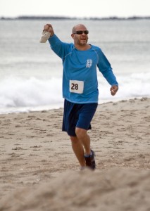 Terry Lane from Jacksonville, Fla. completes the 4-mile run on the beach strand during the Wrightsville Beach Biathlon March 28.
