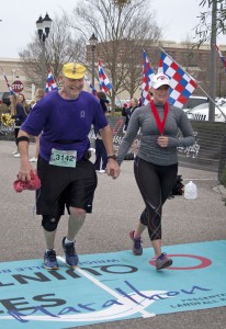 Amanda Wickman crosses the finish line with her father, Gene Hickman.
