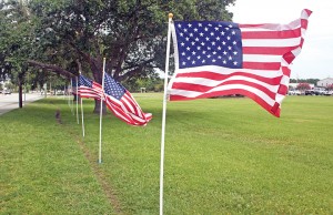 Staff photo by Emmy Errante. American flags line the sidewalk in front of Wrightsville Beach town hall Saturday, July 4.