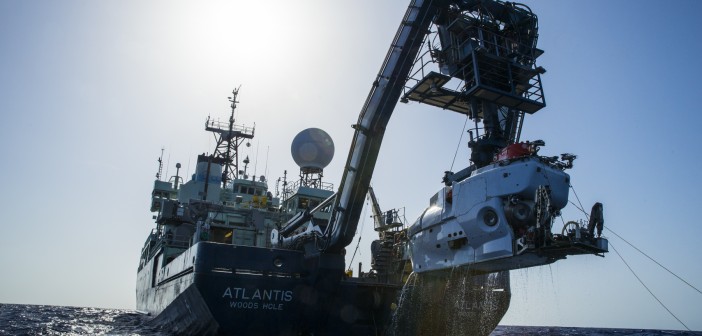 The research vessel Atlantis with the submersible Alvin hanging off its stern..