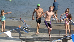 Swimmers finish the Swim the Sound at the Blockade Runner Beach Resort the morning of June 11.