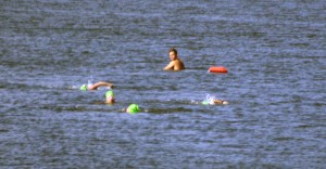 Swimmers complete the Swim the Sound through Banks Channel the morning of June 11.