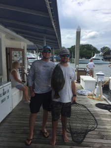 Dylan Jefferys and Chase Leblanc, of Team Hemmed Up, show off the winning flounder. Photo courtesy of Fisherman's Post.