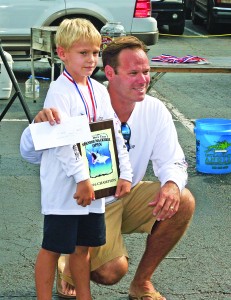 Staff photo by Terry Lane Kevin McKay, of Wilmington, and son Harris, were part of the “Tailwalker” boat that won the Wide Open Tech Spanish Mackerel Tournament on Sunday, Aug. 21.